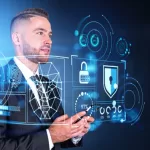 Dreaming handsome businessman wearing formal wear standing holding smartphone with digital interface with hud in background. Concept of cybersecurity, data and information protection, cyberattack